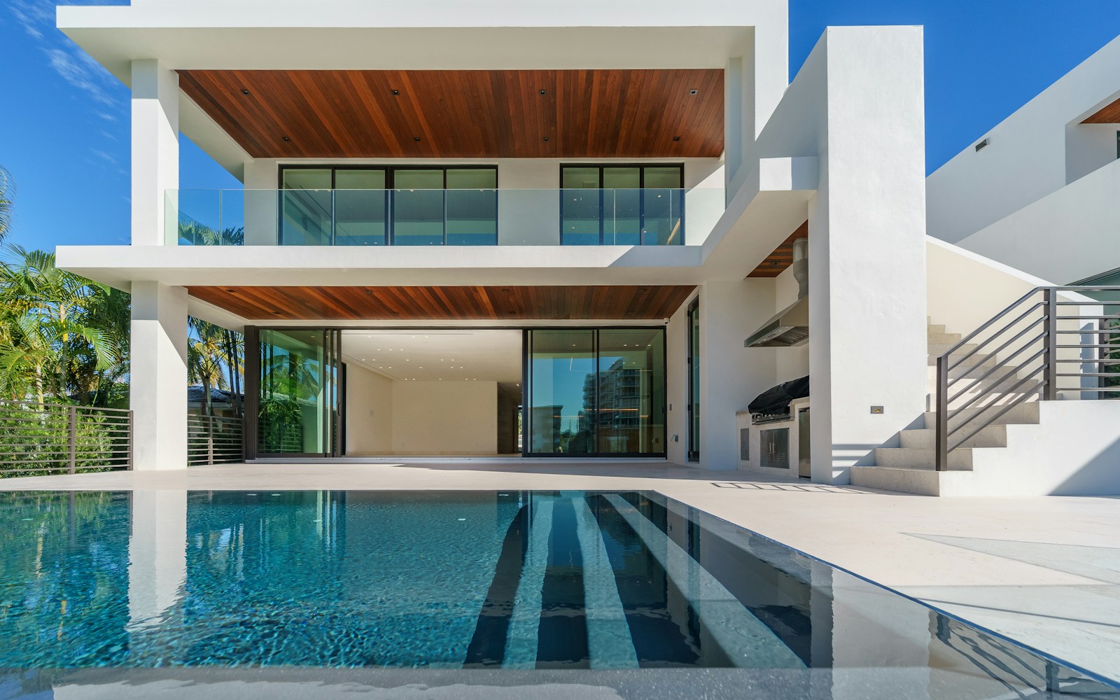 Modern luxury vacation condo with private pool and palm trees
